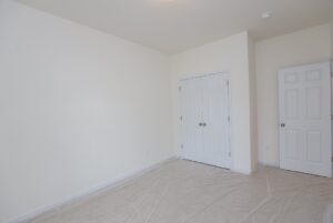 Bright, empty room with white walls—just one feature in beautiful new homes in Richmond VA.