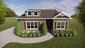 Green house with dormer windows and brown shutters in Poplar Village, on a lawn under a partly cloudy sky.