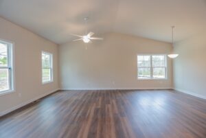 Empty, bright room with wood floors and modern fixtures—perfect for new homes in Richmond, VA.