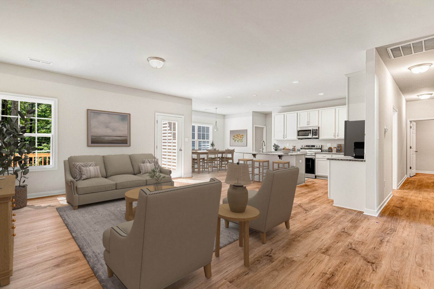 Open-plan living room and kitchen in Patrick Henry Heights Lot 57, with neutral decor and large, light-filled windows.