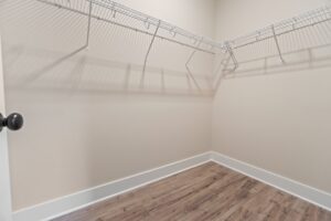 Spacious walk-in closet with wire shelves, featured in stylish new homes in Richmond VA.